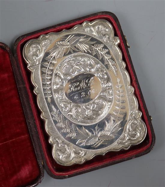 A late Victorian silver card case, by Hilliard and Thomason, Birmingham, 1879, in a morocco leather case 11 x 7cm